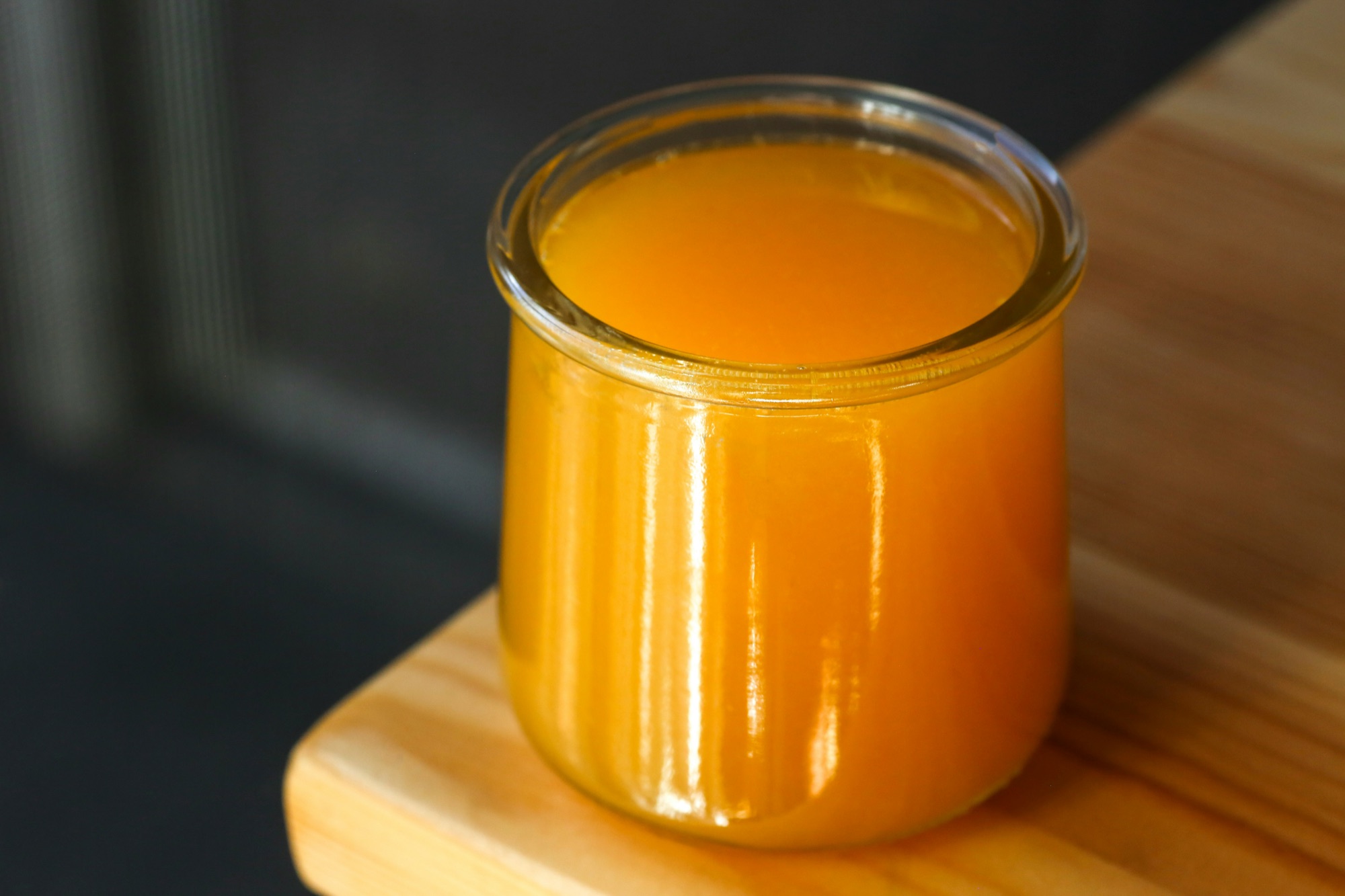 A glass jar of golden ghee