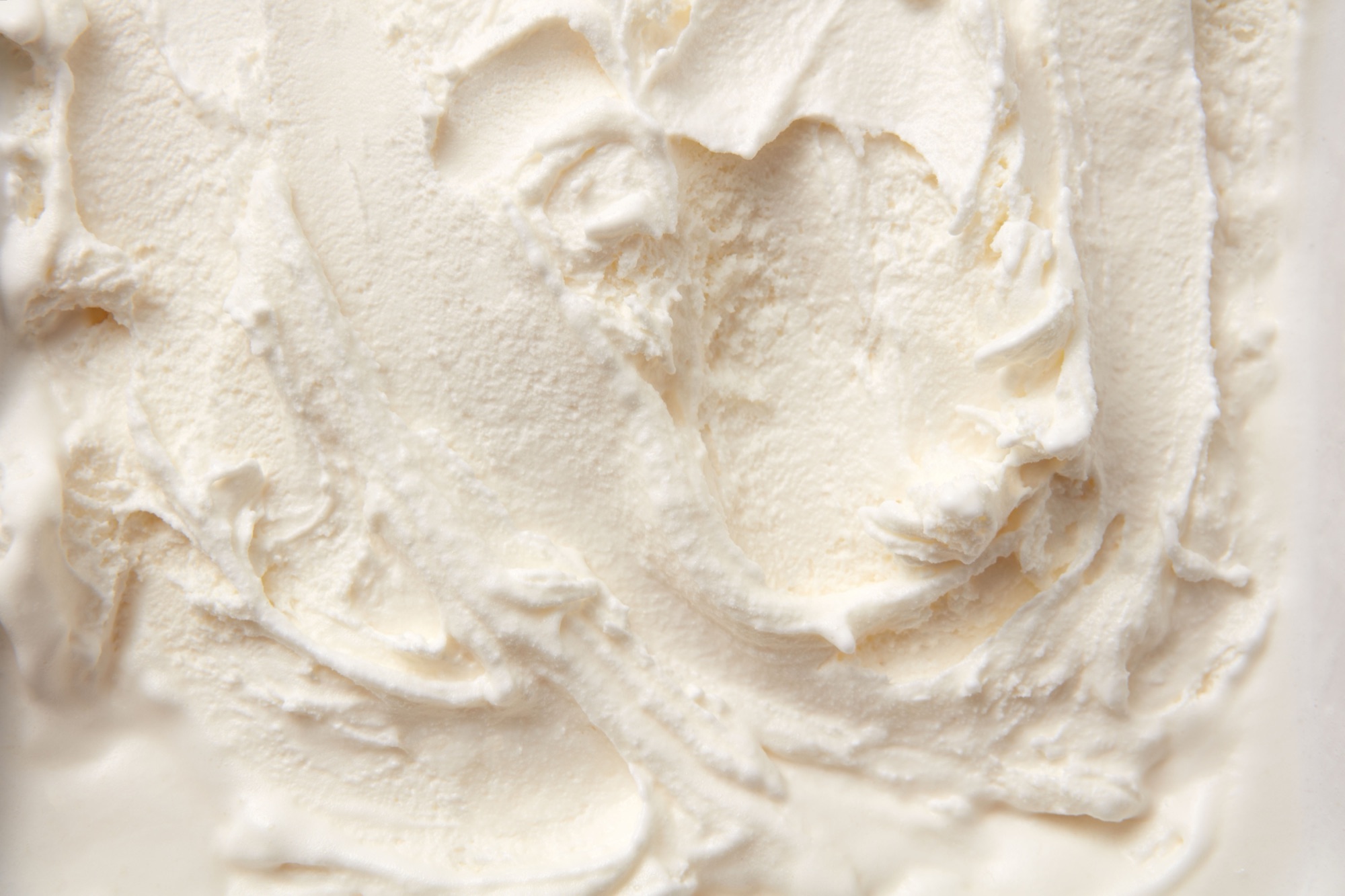 A close-up texture shot of whipped heavy cream